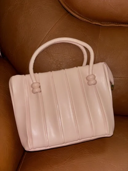 Baby pink handbag